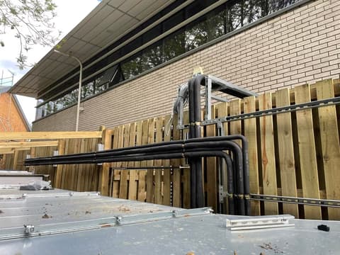 Neatly routed and insulated air conditioning pipework on a professional installation
